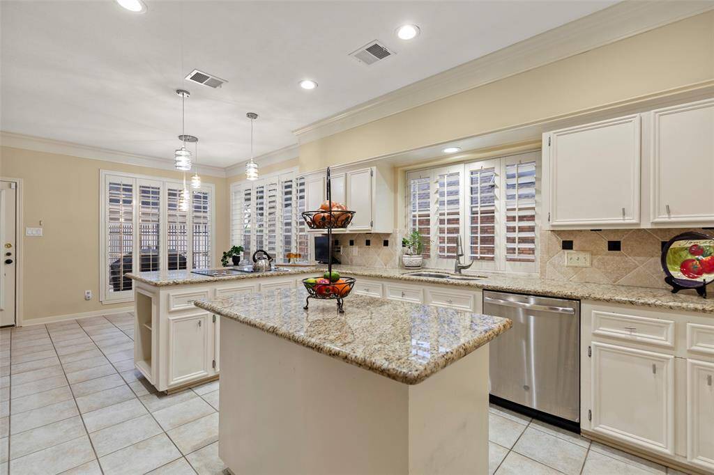 Open Layout and Tiled Floor Enhance the Spacious Feel with Lovely Granite Countertops.