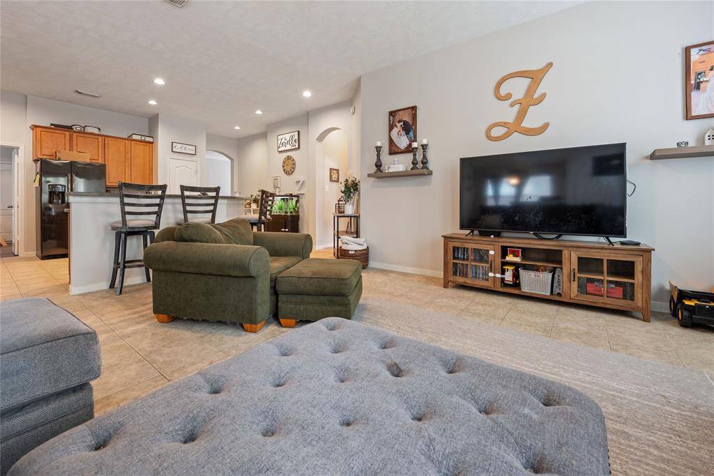 GREAT SPACE! Large living room is open to kitchen with counter height bar top island, making this large, open space, perfect for entertaining. Plenty of spaces for people to gather!