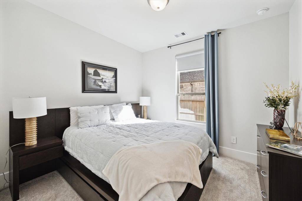 This secondary bedroom is downstairs and has its own ensuite bathroom!