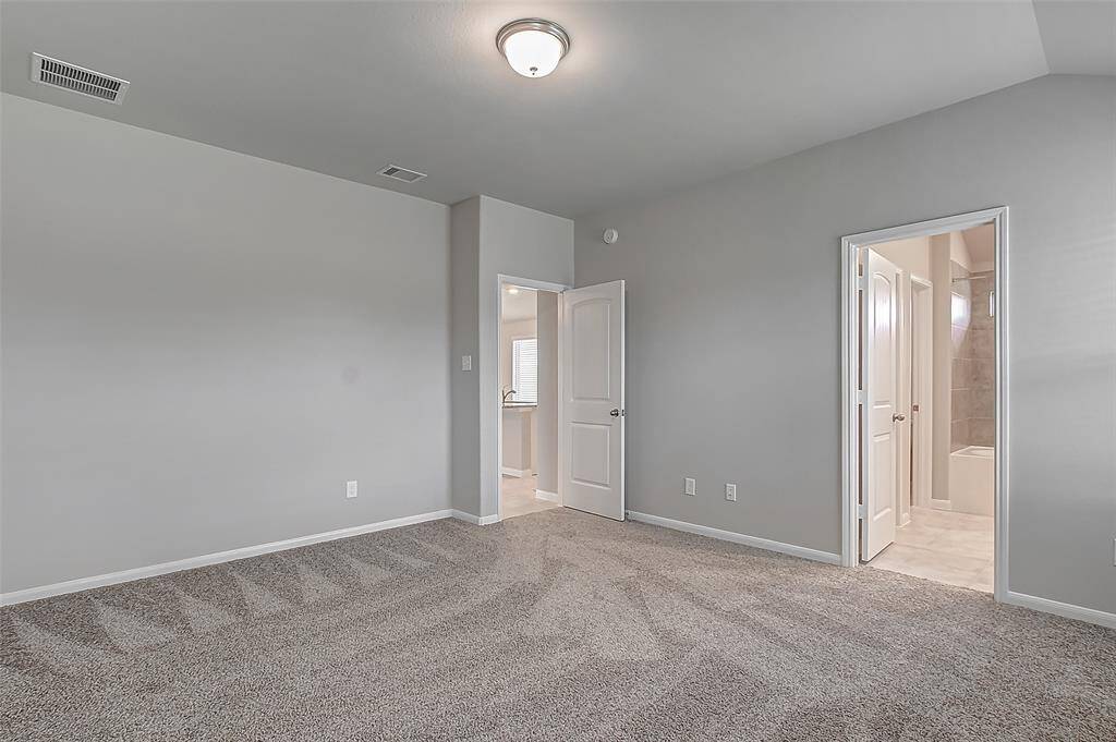 Door on the right leads to ensuite primary bathroom.