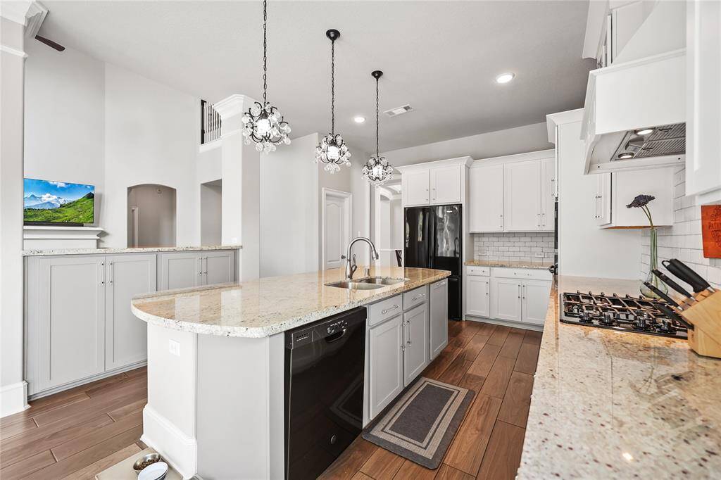 With clear sightlines into the living area, this design enhances connectivity and warmth, making it an inviting and functional heart of the home.