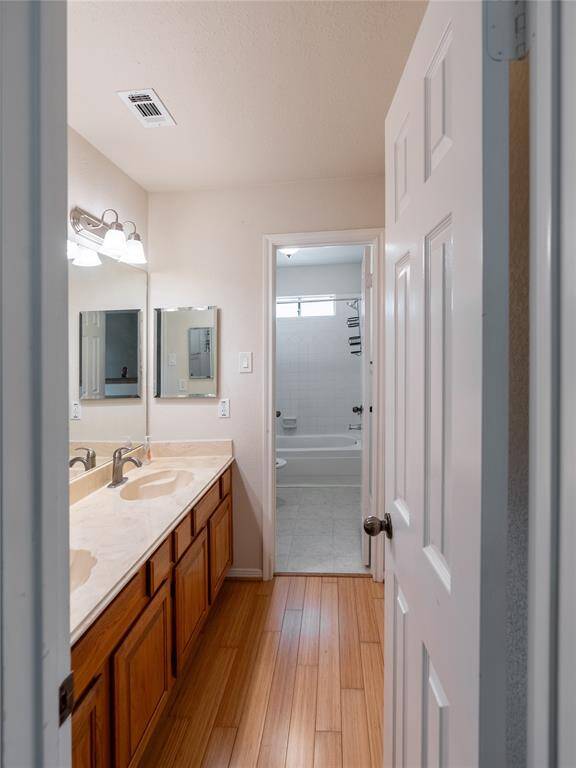 Full bath upstairs with bath and shower combo and double vanity