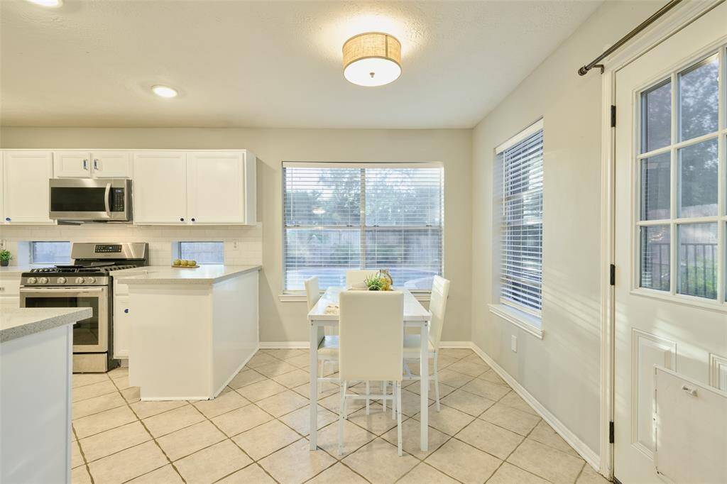 There is plenty of natural light in the breakfast room from the large windows.