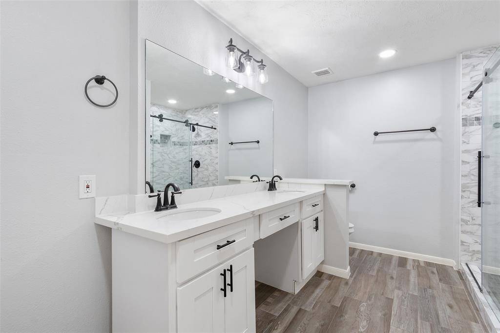 The spacious walk in shower, is the perfect place to relax after a long hard day of work.