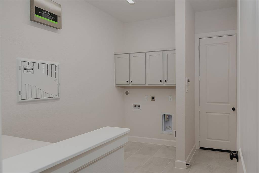 Laundry Room with pass through to garage