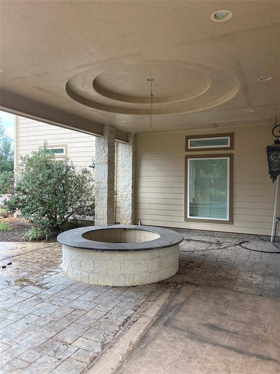 Primary private covered patio with gas fireplace