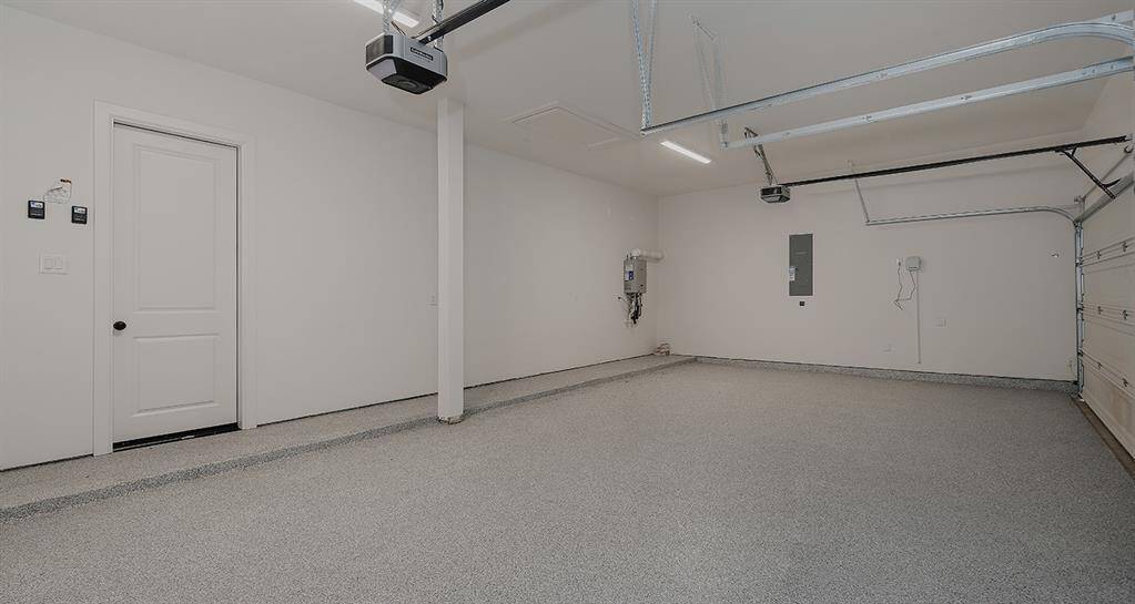 3 car garage with epoxy floors