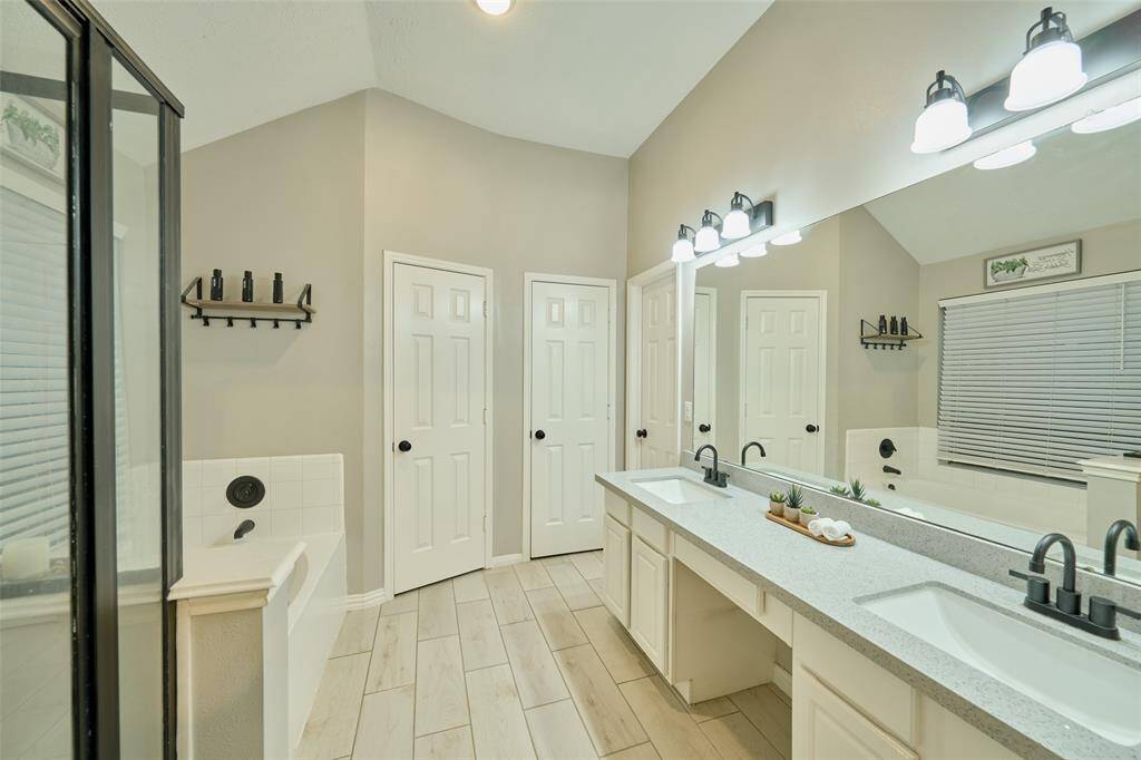 The primary bathroom also features 2 walk-in closets, and separate water closet.