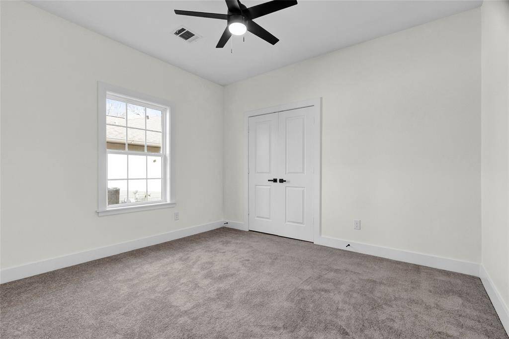 Third bedroom with custom trim around window as well