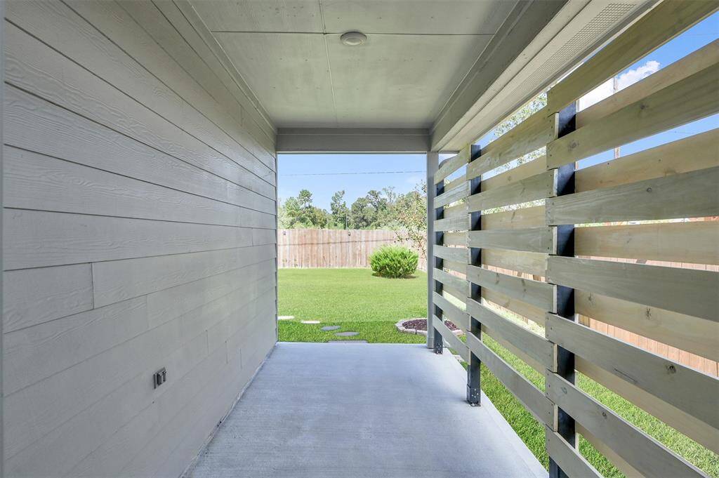 Extended covered patio w/ custom privacy wall