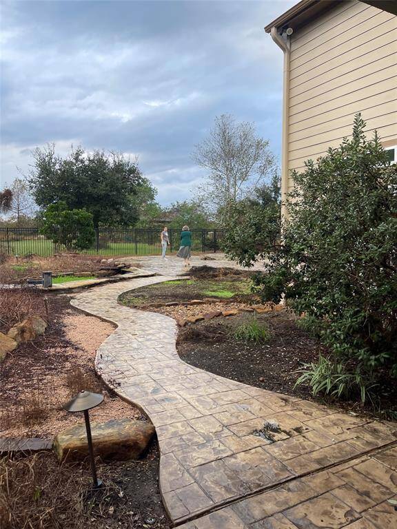 Walkway to large patio and back acreage