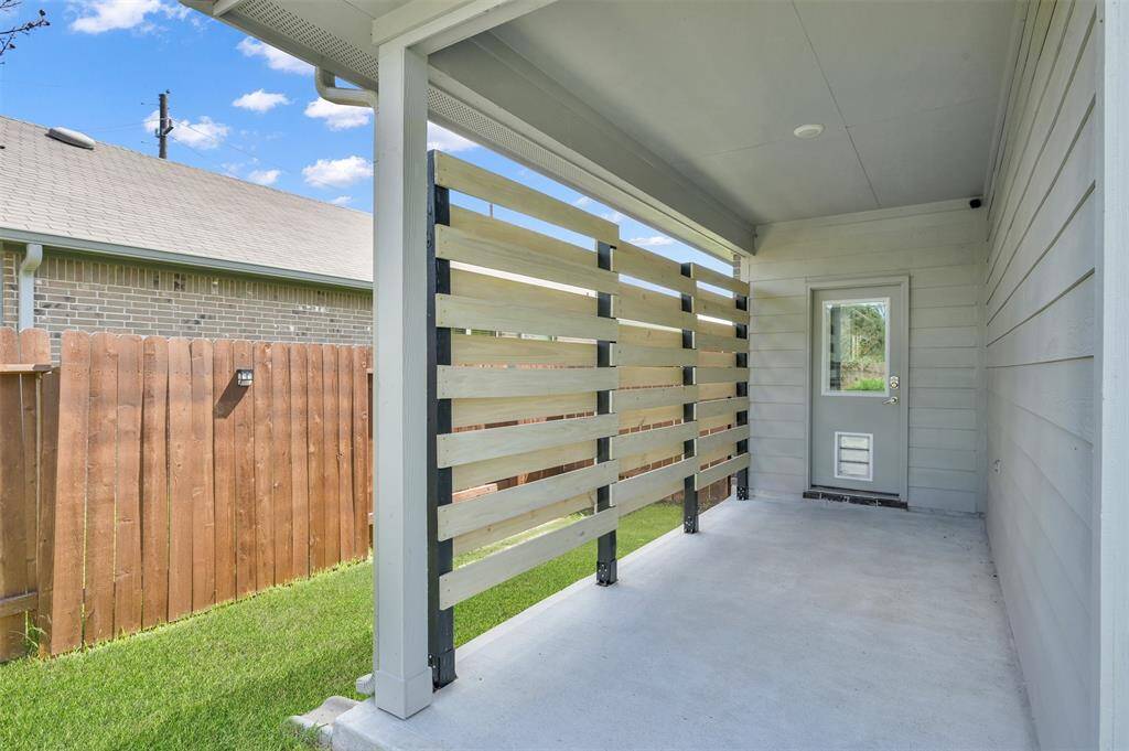 Extended covered patio w/ custom privacy wall