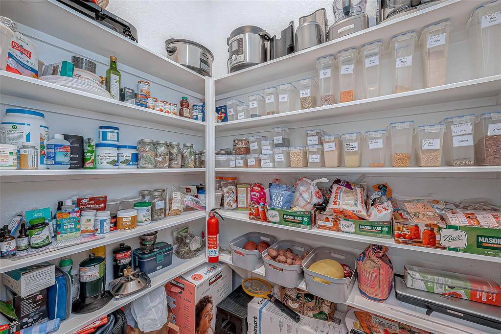 Walk-in pantry with exceptional shelving space!