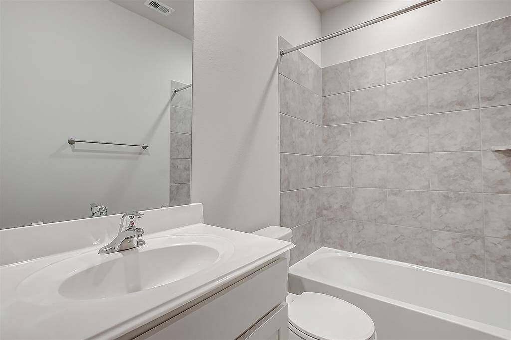 Secondary bathroom with fully lined shower/tub.