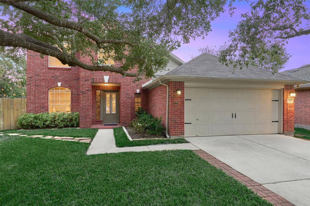 This home features a double wide driveway and attached 2 car garage.