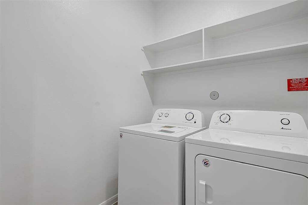 Laundry room with washer and dryer provided.