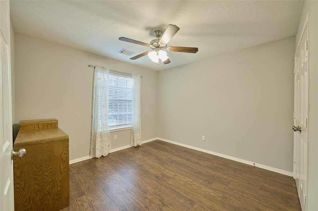Take a look at this flexible secondary bedroom with ceiling fan.