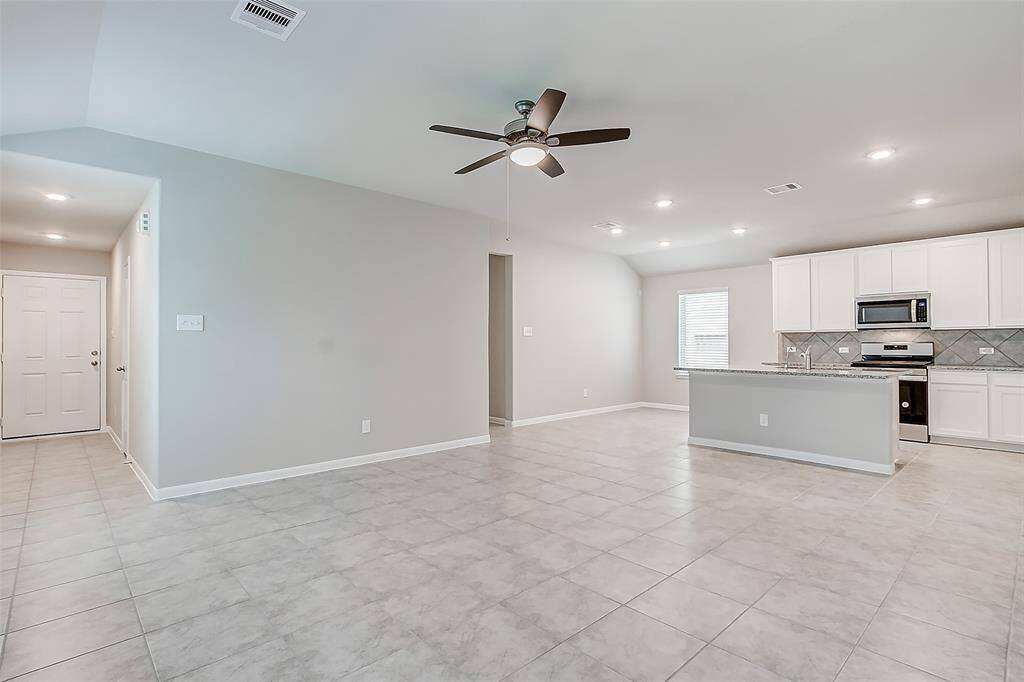 Front door on the left leads into open floor plan living area.