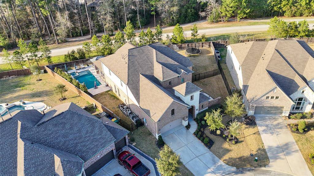 An aerial view of the property that perfectly shows the fence lines and the privacy this residence offers.