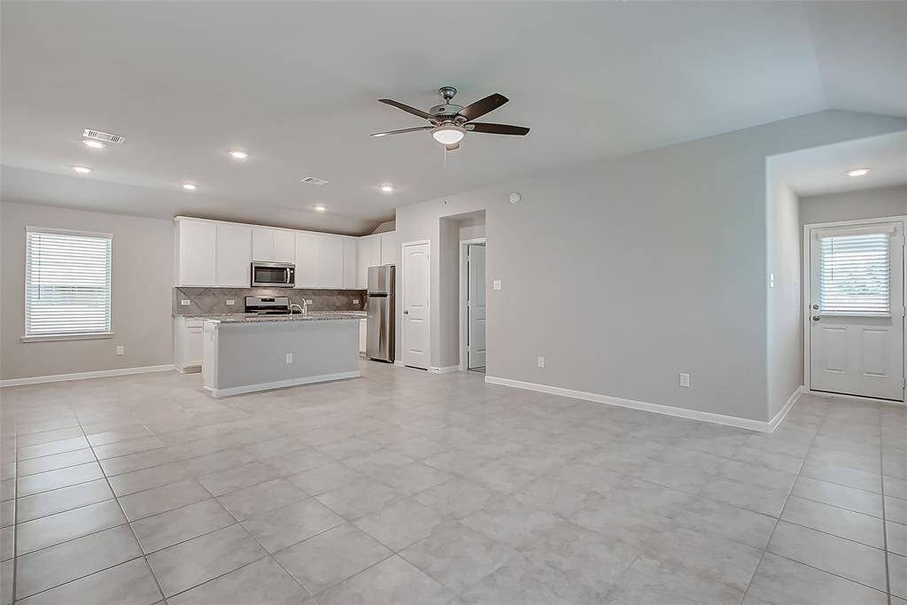 The living room is large enough to accommodate all your furniture.