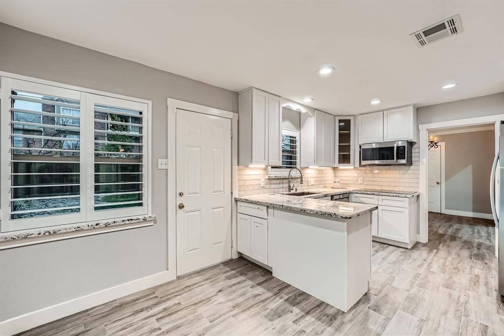 A breakfast nook off of kitchen opens on to your huge yard!