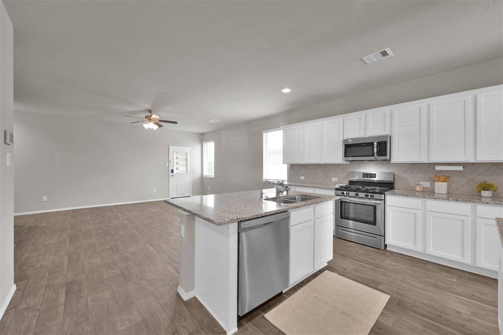 Open concept kitchen/living area.
