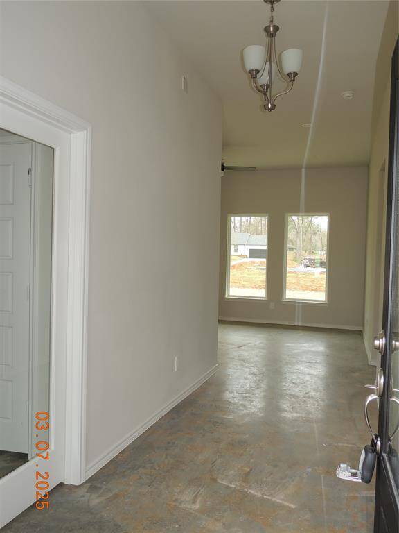 Grand Foyer with an office entryway