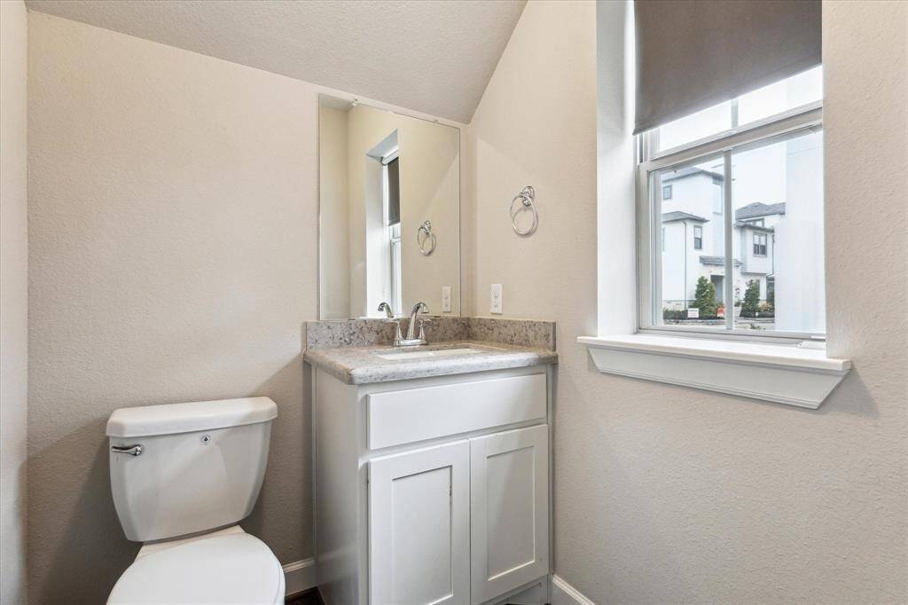 This conveniently located half bathroom on the first floor is perfect for both guests and family. Strategically positioned away from the kitchen, it offers an ideal setup for privacy and ease of access, enhancing the overall comfort and functionality of your home.
