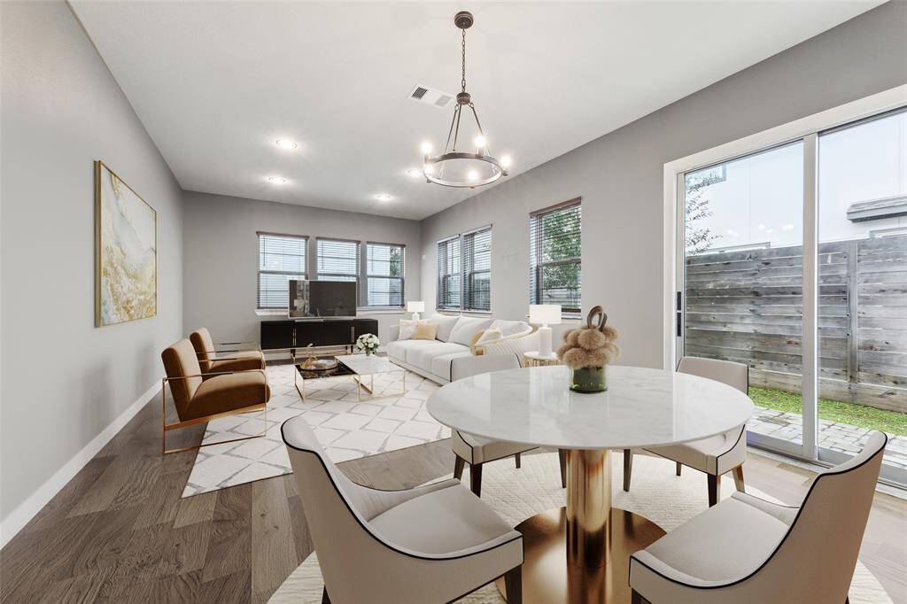 The layout of the first floor is thoughtfully designed to create a seamless flow between the dining room, kitchen, and living room, forming a spacious open area ideal for gatherings and everyday life.(Digitally Staged)