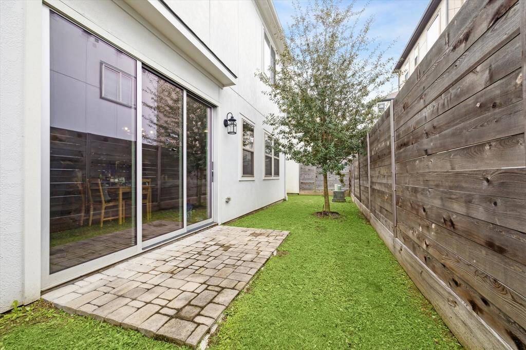 The side glass door offers easy access to both the side yard and backyard, enhancing the home's connection to outdoor areas. This accessibility makes it simpler to enjoy outdoor activities and adds a layer of versatility to how you use your home's space.