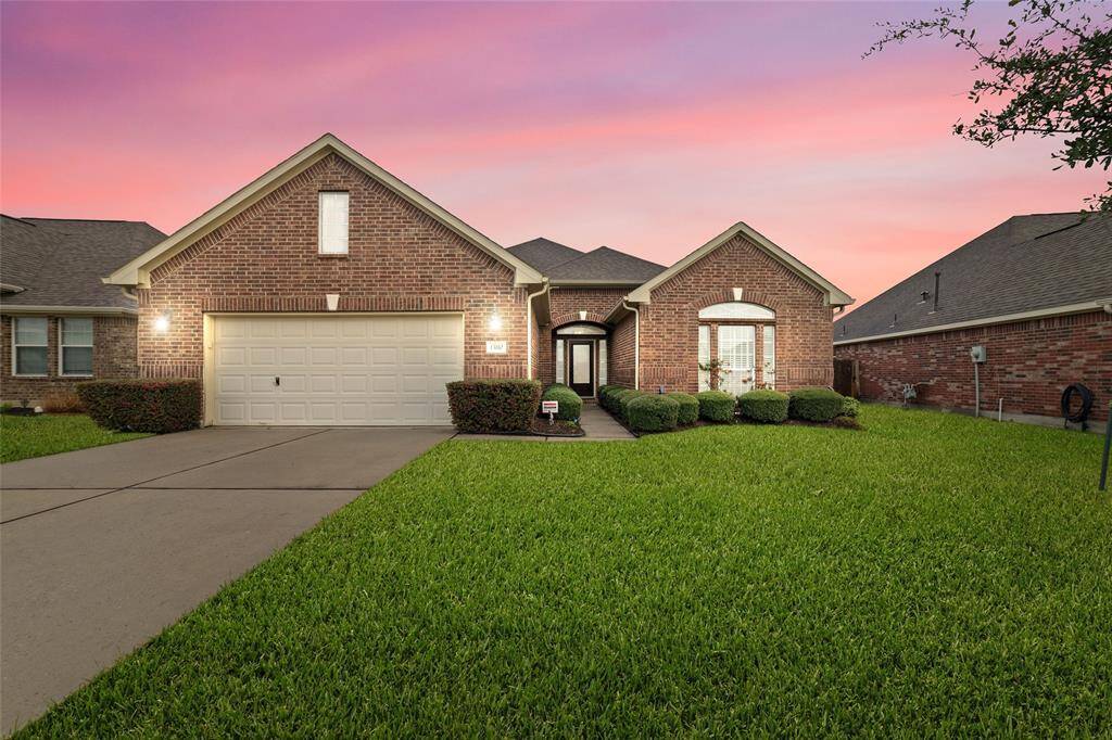 Welcome home to Northwood Glen Ln, a stunning first impression, with its well-manicured lawn and lush greenery creating undeniable curb appeal.
