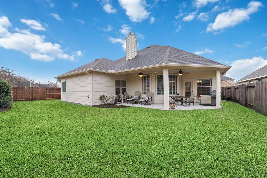 The included grill makes outdoor cooking a breeze, while the fenced yard offers privacy.