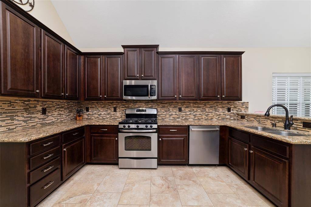 Thoughtfully designed, it offers ample cabinet space and a functional layout for easy meal prep.