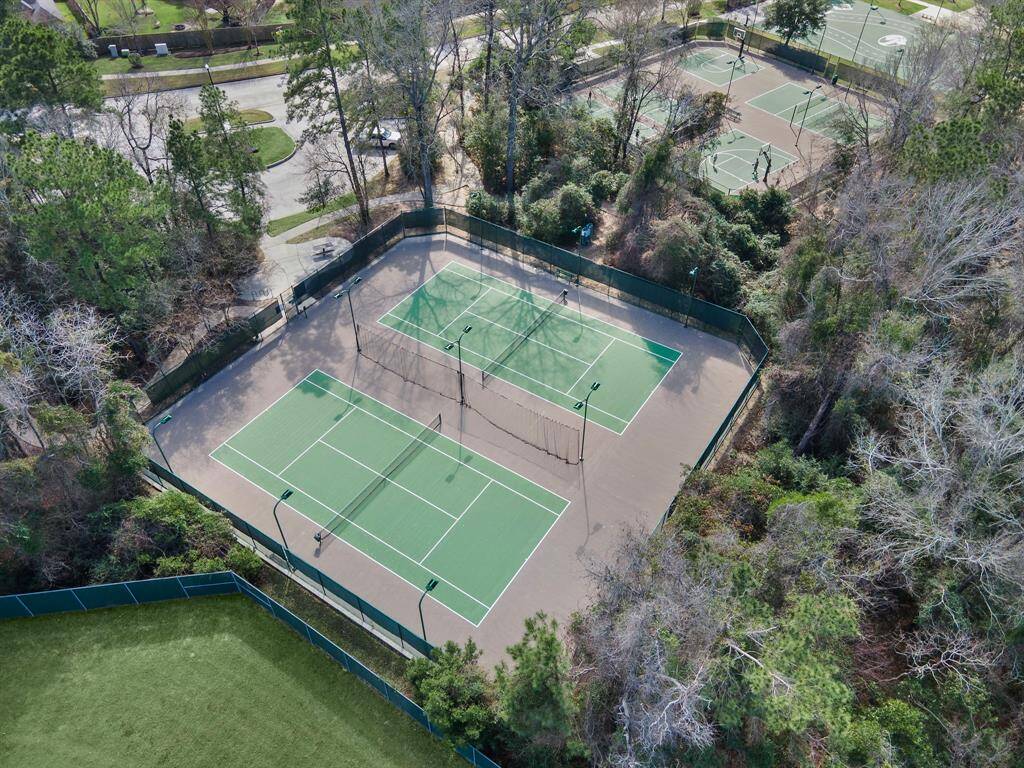 Explore the beautifully maintained tennis courts nestled within the amenity-rich Spring Trails community. Surrounded by lush greenery, these courts provide an ideal setting for sports enthusiasts seeking recreation and leisure.