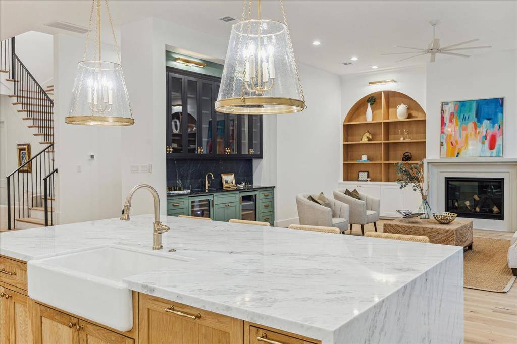 The white oak island offers additional storage as well as the best seats in the house! You will love the 36" farmhouse, single basin, apron front cast iron sink.