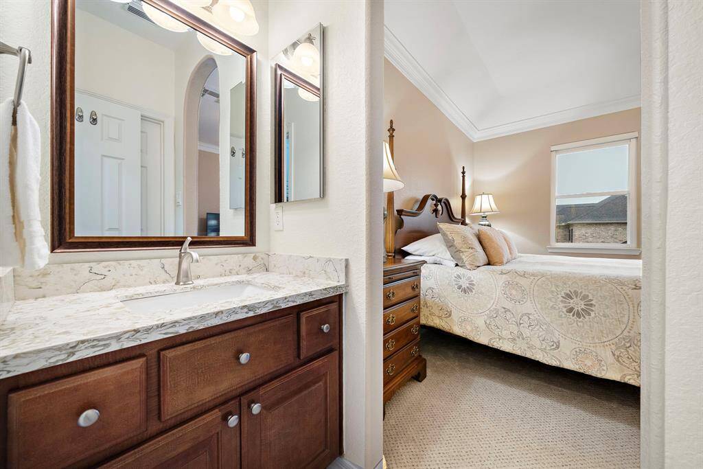 A thoughtful layout ensures seamless flow between the bedroom and bath, creating a private retreat designed for comfort and convenience.