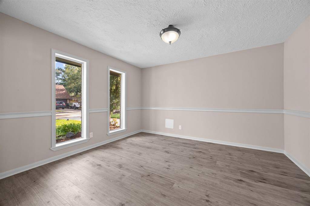 Front room that can be used as a formal dining area or home office without the virtual staging.
