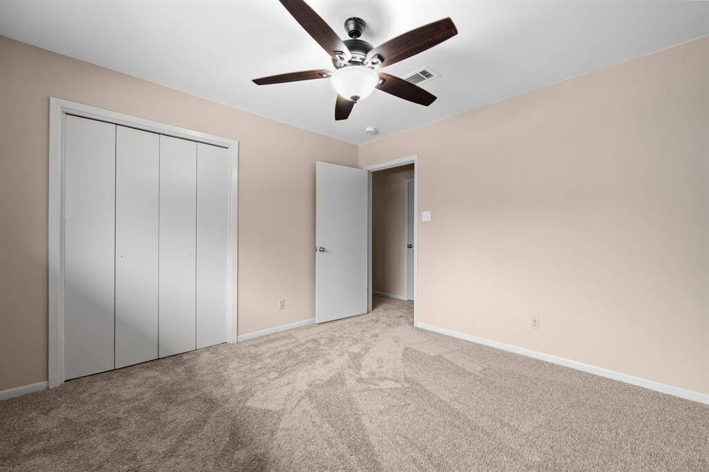 Spacious bedrooms have new plush carpeting, new ceiling fans and fresh paint.