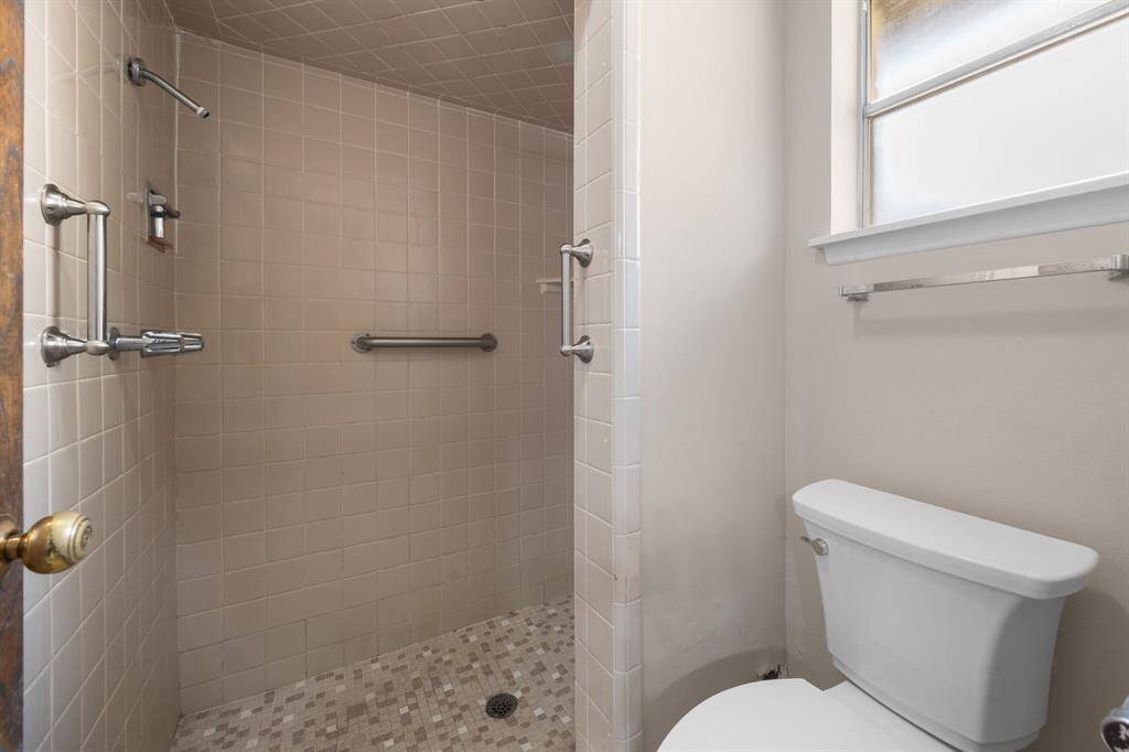 Walk in shower with security handles and new toilets.