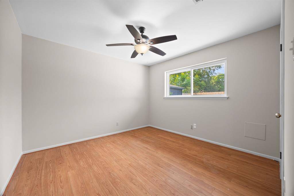 Nice laminate flooring in one of the secondary bedrooms that could also make a great home office.