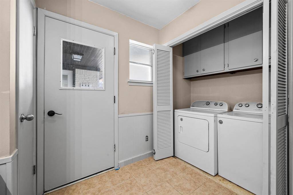 Laundry is conveniently located with door to the outside pool area.