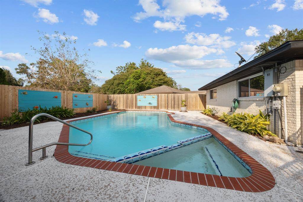 Well maintained pool with ample patio space circling the pool.