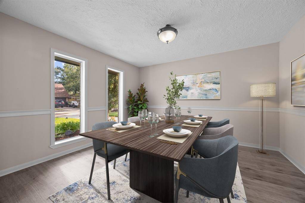 Experience the potential of this space with our digitally staged dining area that could also be used as a  home office.