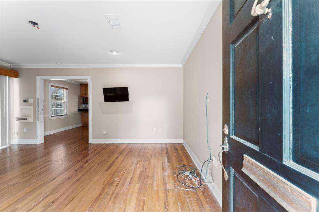 Real hardwood floors await you as you walk inside.