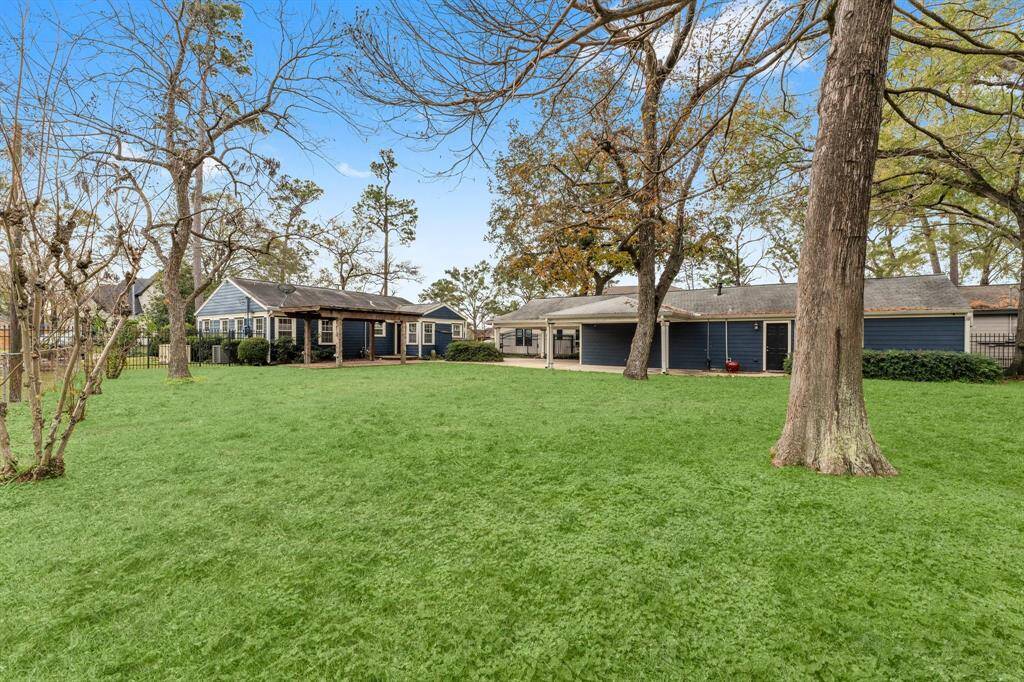 Tremendous lot that offers great space to add on to the home, build a pool or rebuild larger and more modern!