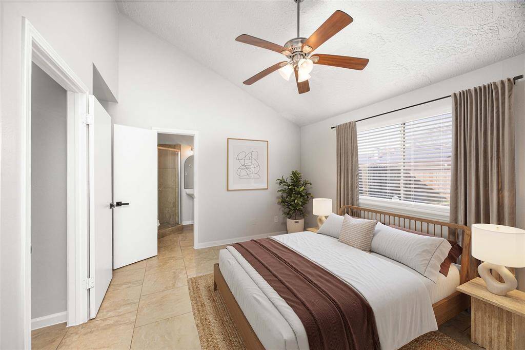 Primary bedroom with ensuite bathroom (virtually staged)