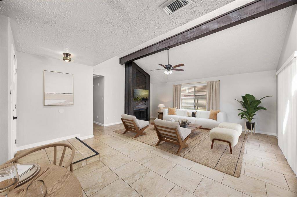 Alternate view of living/dining area (virtually staged)