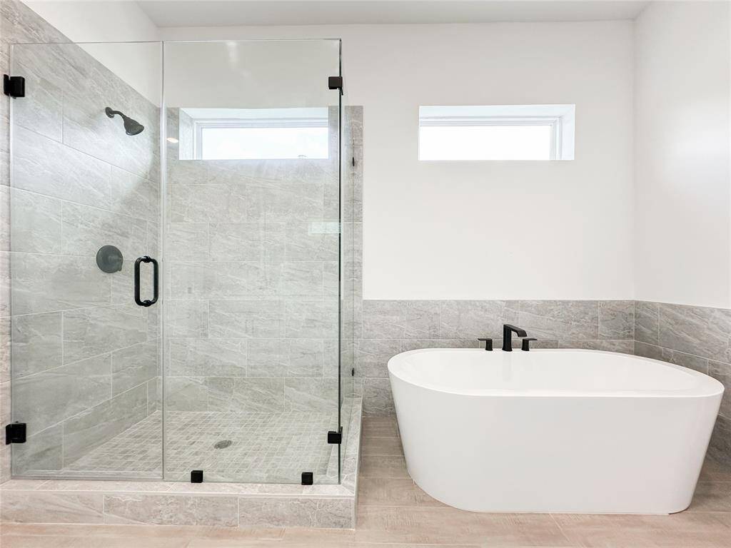 Separate bathtub and stand up shower