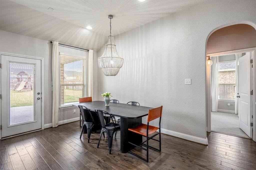 Make memories gathered around the table with your family and friends! This dining room features high ceilings, crown molding, large windows, and a beautiful chandelier!