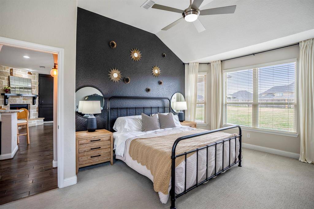 The primary bedroom welcomes you with bright natural light, an upgraded bay window with a relaxing sitting area, and the perfect view of the serene yard. It sits at the back of the home offering additional privacy and easily fits a king size bed plus furniture!